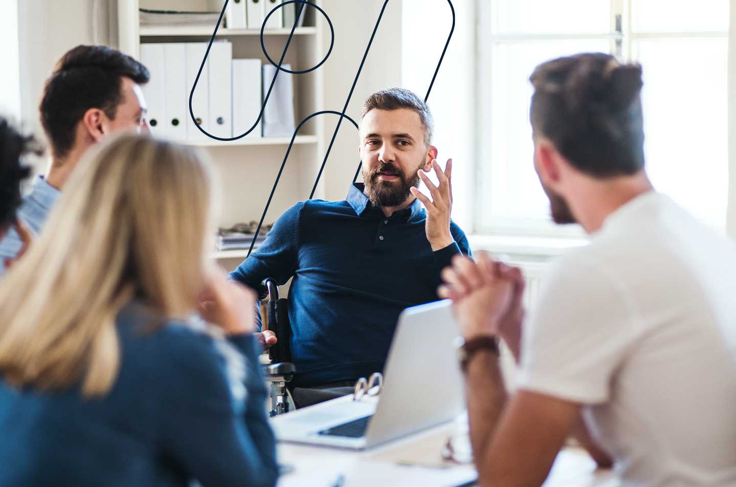 a group of colleagues sitting around a desk